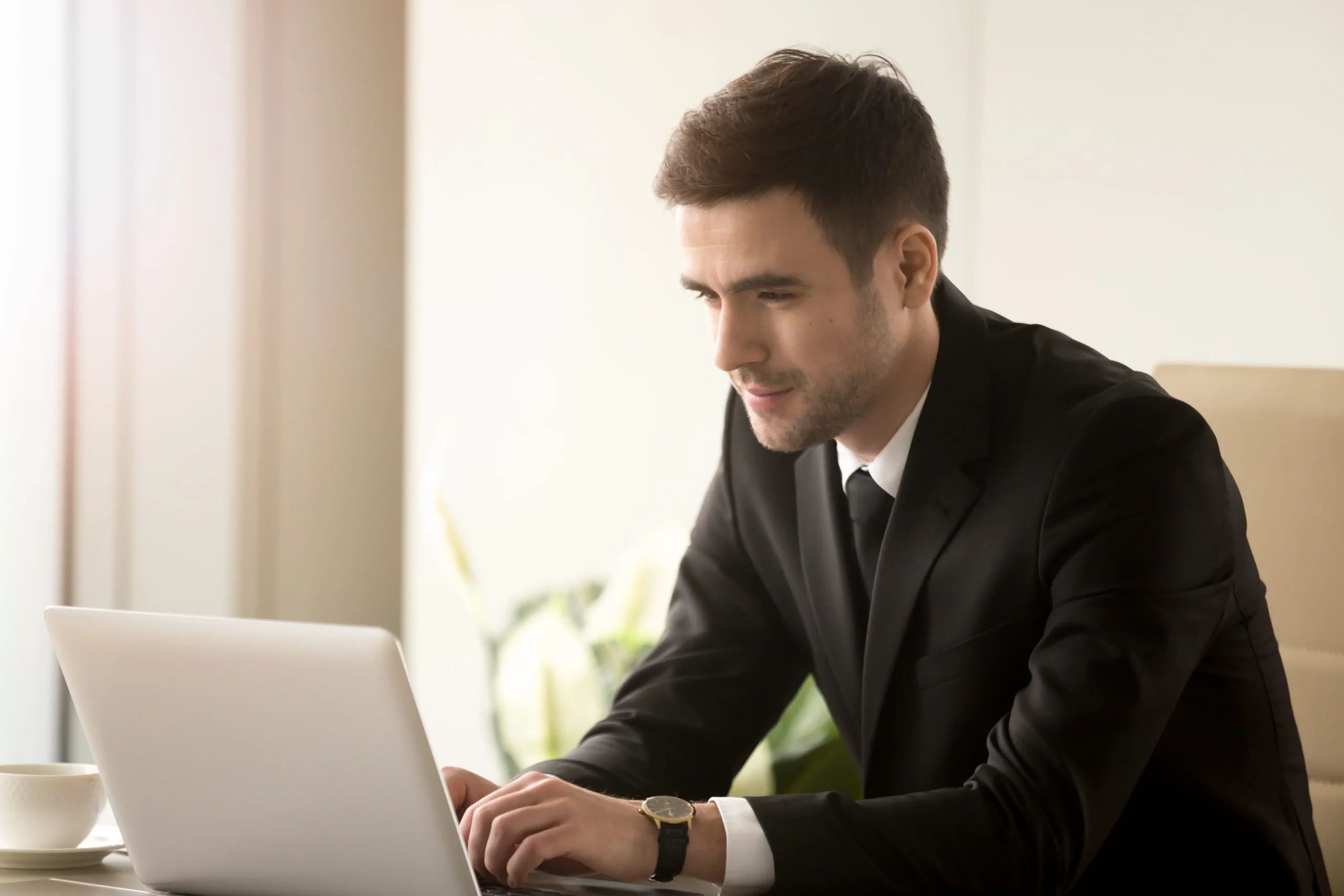 male-office-worker-working-laptop-office
