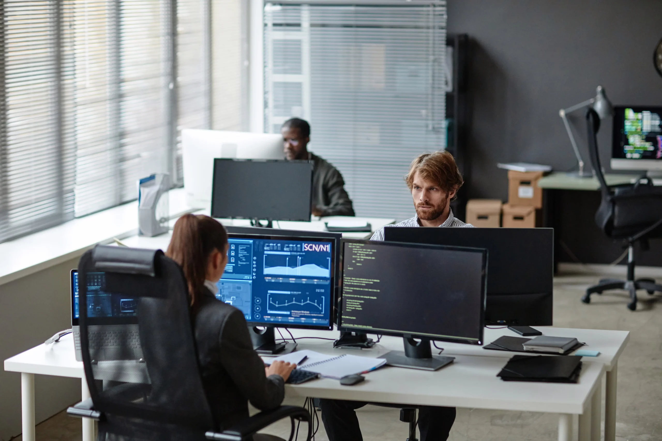 young-it-developers-working-with-multiple-computers